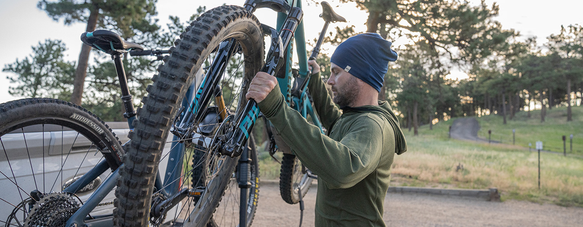 man getting ready to go biking wearing micro weight merino wool