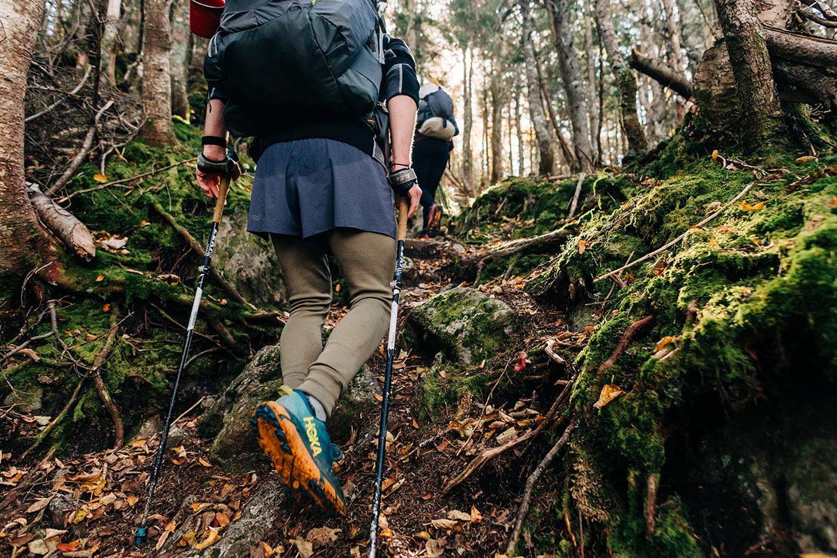 man hiking wearing lightweight base layers