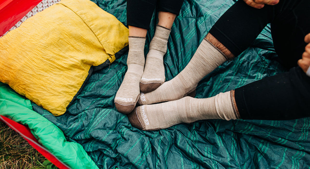 couple wearing matching merino wool oatmeal socks