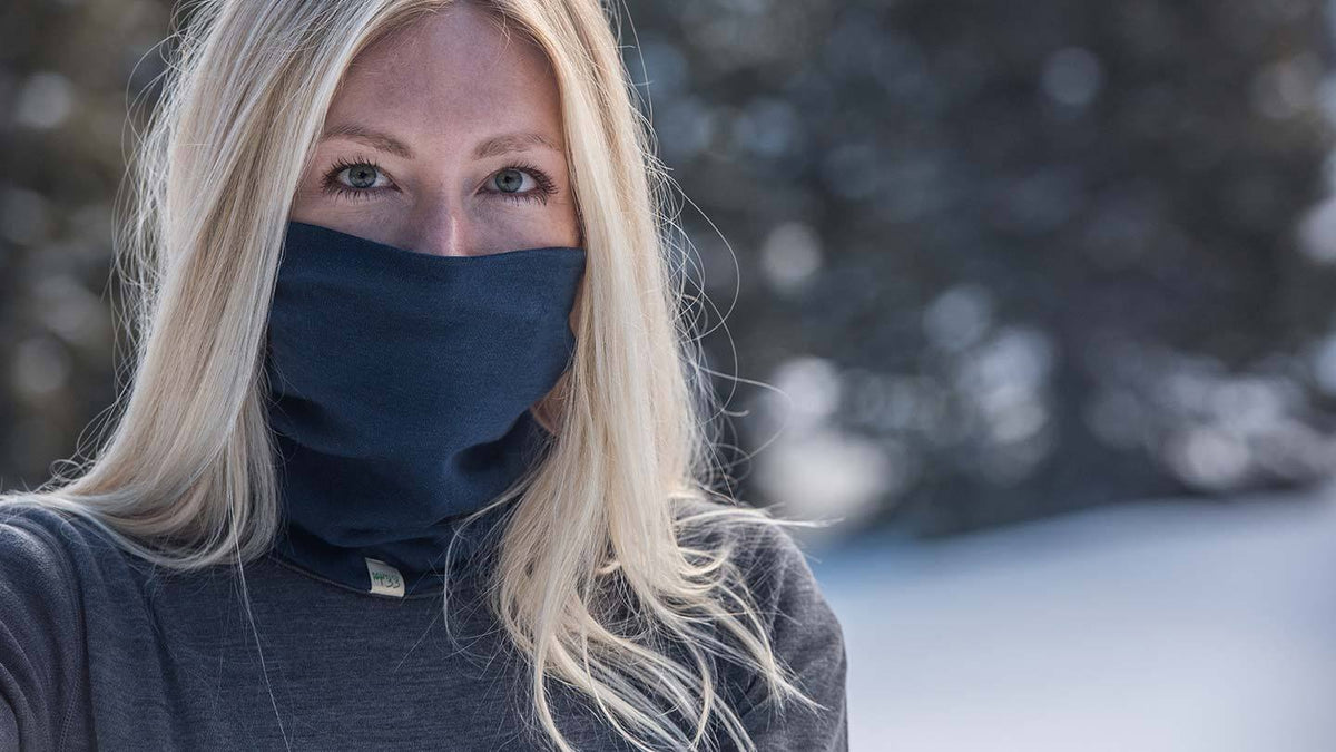 closeup of woman in snow wearing midweight minus33 merino Wool Neck Gaiters