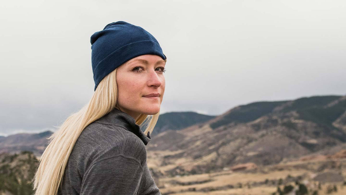 Woman hiking while wearing Minus33 Ridge merino wool beanies