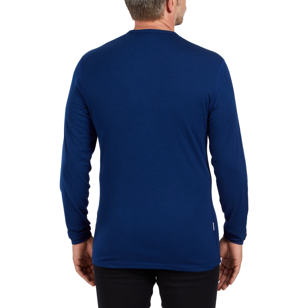 A man models the microweight long sleeved merino wool base layer crew neck top, back view 