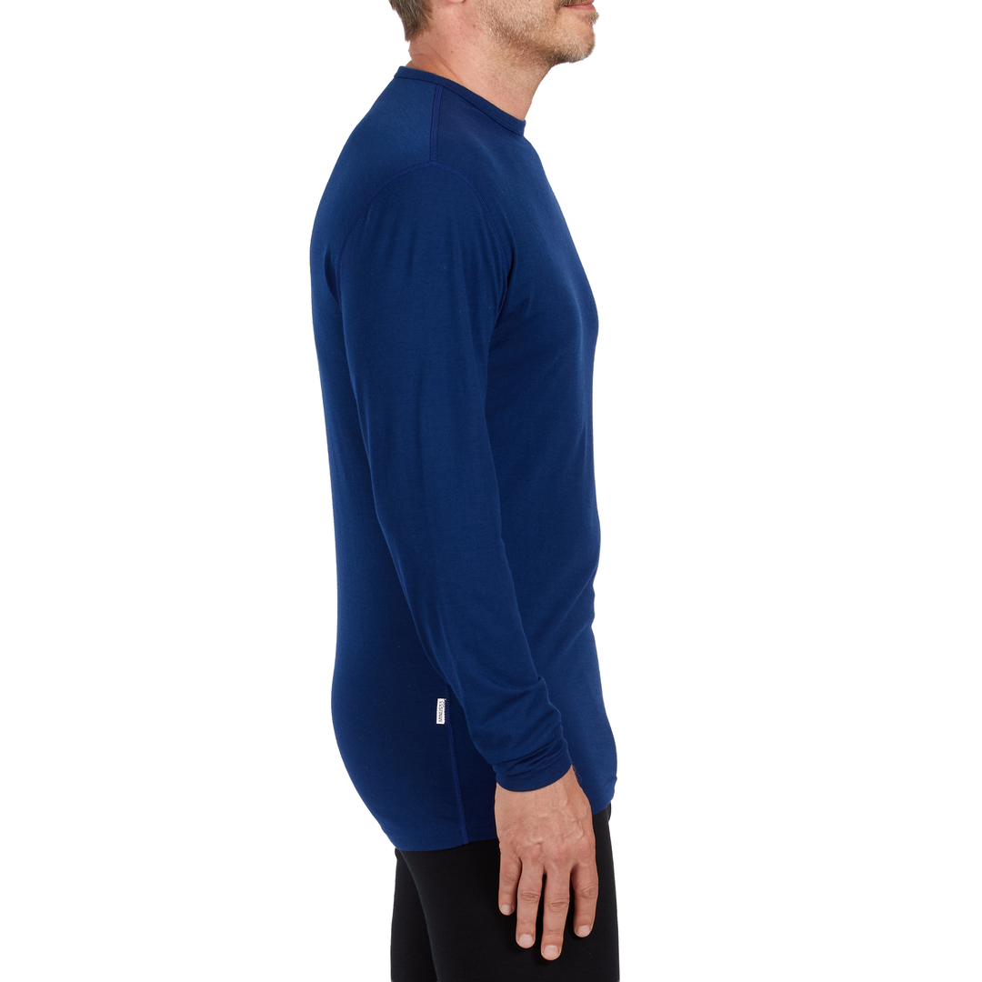 A man models the microweight long sleeved merino wool base layer crew neck top, side view 