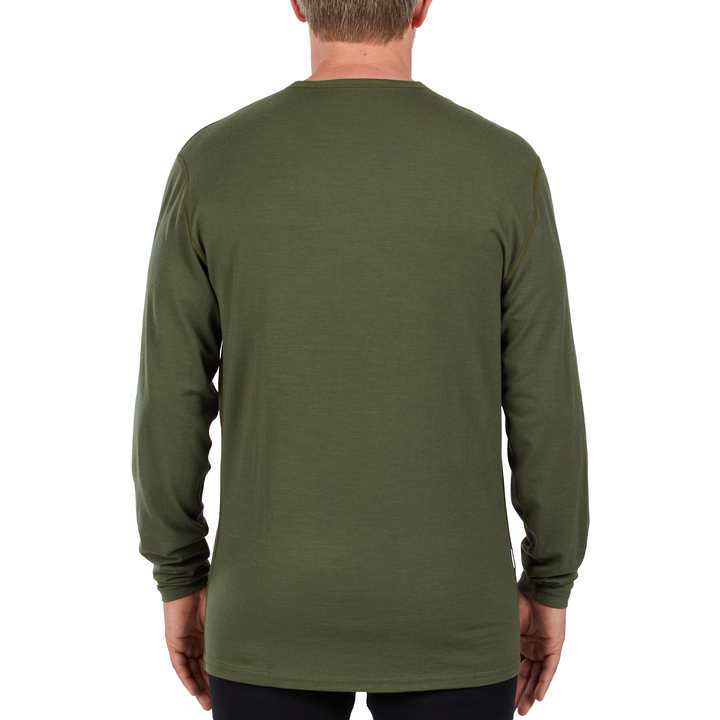 A man models the microweight long sleeved merino wool base layer crew neck top, back view 