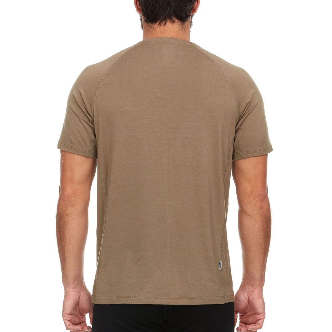 A man models the microweight Merino wool t shirt, your perfect choice for hitting the gym or setting foot on the trails. Raglan sleeves and side panels create a garment that moves with you 