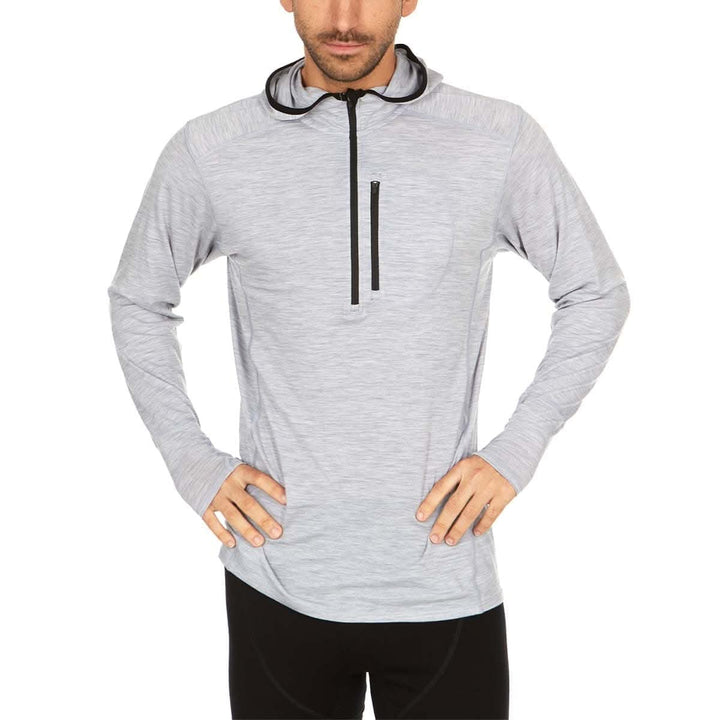 A man models the super light microweight merino wool quarter zip sun hoodie. 