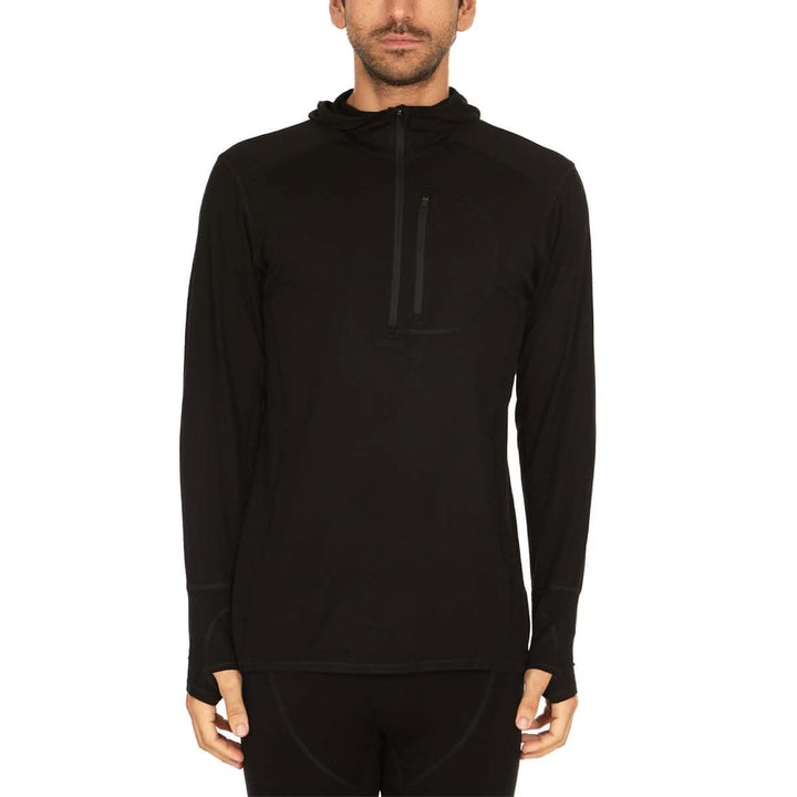 A man models the super light microweight merino wool quarter zip sun hoodie. 