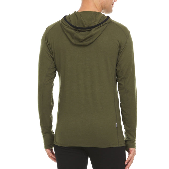 A man models the super light microweight merino wool quarter zip sun hoodie.  