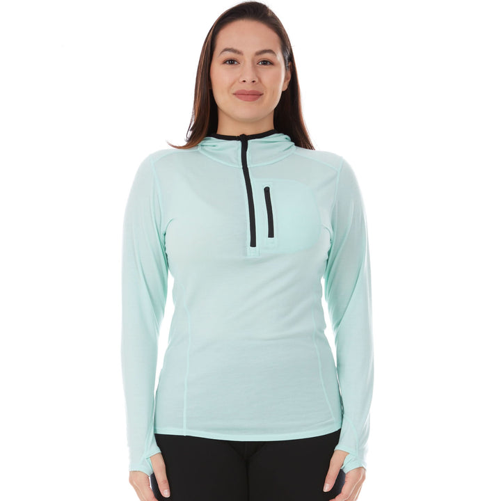 Woman wears a microweight Merino wool sun hoodie  