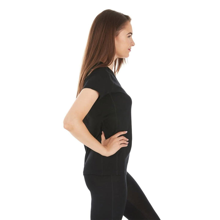 Right side view of a woman wearing a black micro weight merino wool short-sleeve V-neck T-shirt, showing the neckline edge, shoulder seam, fitted sleeve, shaped side, and hip-length hem 