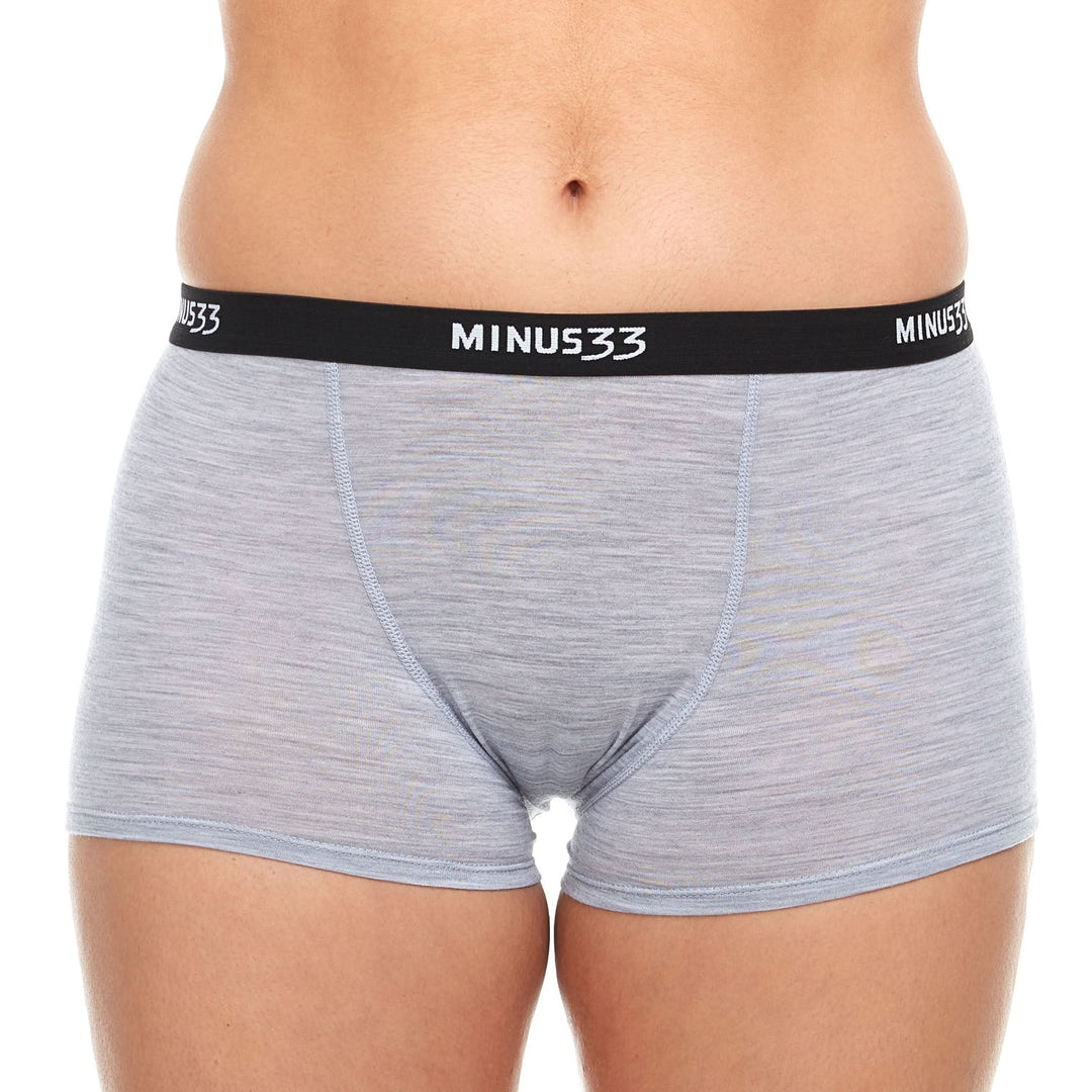 A woman models the microweight merino wool boyshorts. The boyshorts have a one inch inseam and a one inch woven sport elastic waistband. Front view 4. 