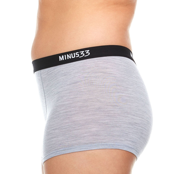 A woman models the microweight merino wool boyshorts. The boyshorts have a one inch inseam and a one inch woven sport elastic waistband. Side view 1. 