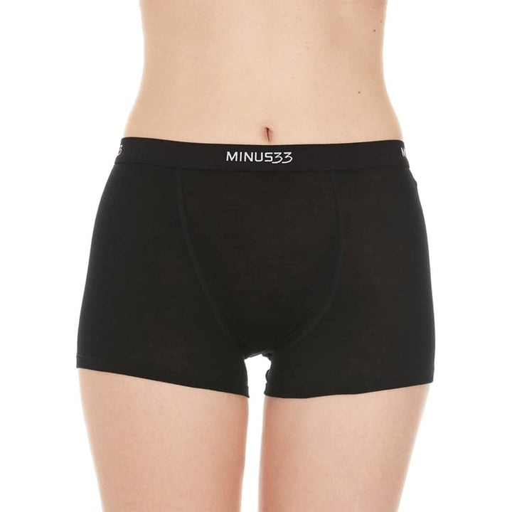A woman models the microweight merino wool boyshorts. The boyshorts have a one inch inseam and a one inch woven sport elastic waistband. Front view 3. 