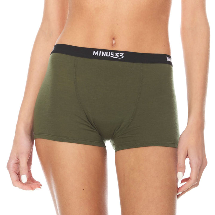 A woman models the microweight merino wool boyshorts. The boyshorts have a one inch inseam and a one inch woven sport elastic waistband. Front view 2. 