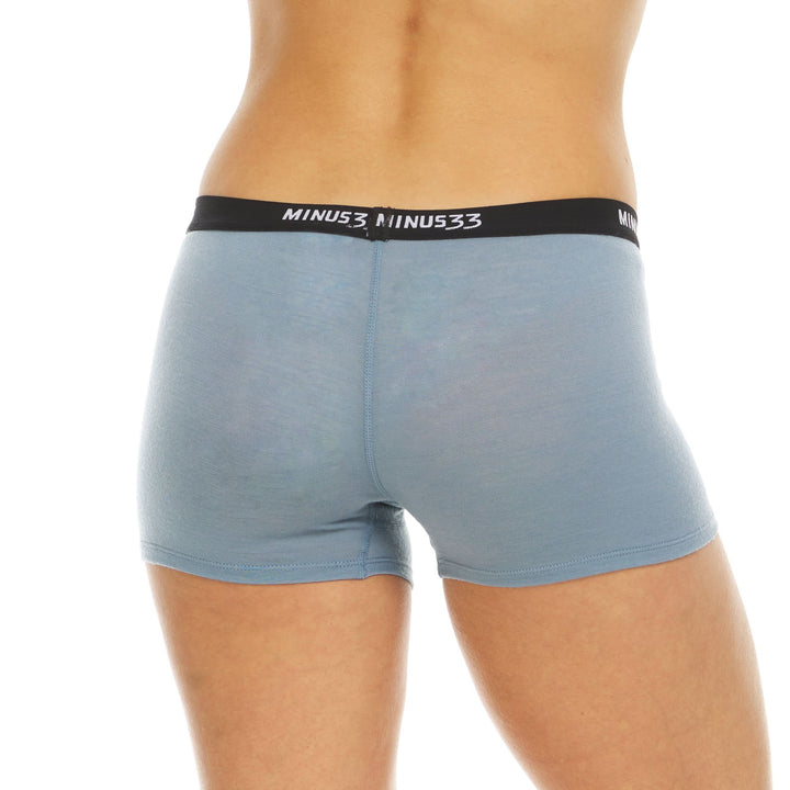 A woman models the microweight merino wool boyshorts. The boyshorts have a one inch inseam and a one inch woven sport elastic waistband. Back view 3. 