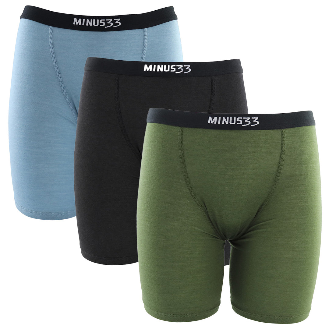 Three pairs of women's merino wool underwear in blue, black, and green with 'MINUS33' branding on a white background.