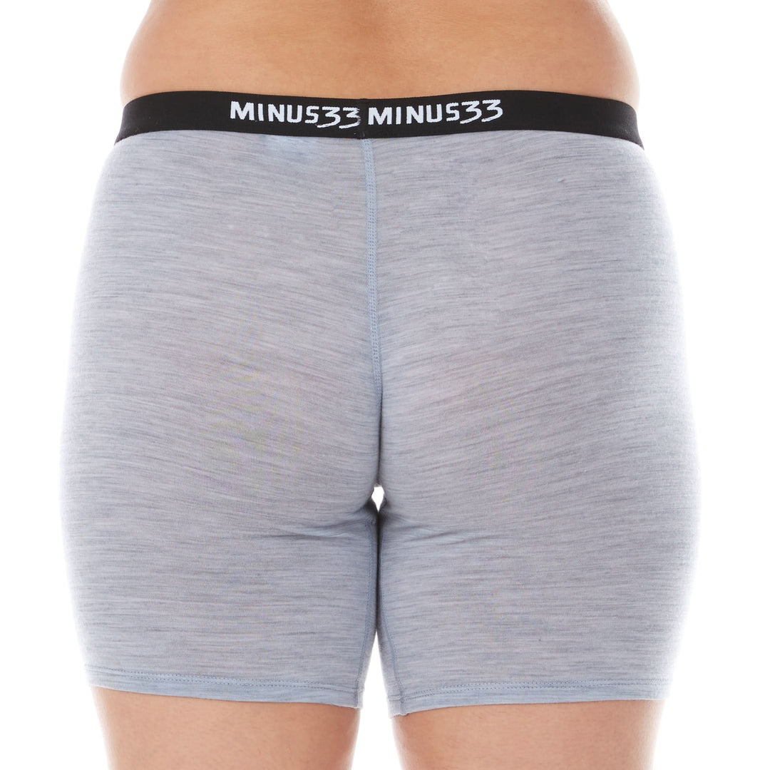 A woman models the microweight merino wool women&