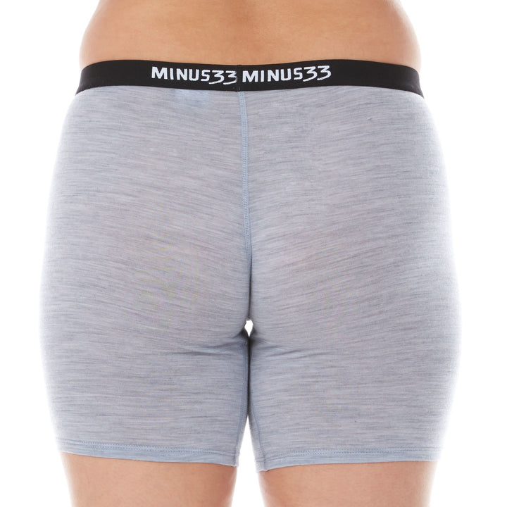 A woman models the microweight merino wool women&