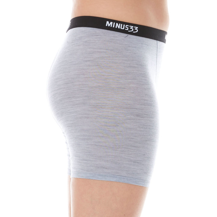 A woman models the microweight merino wool women&