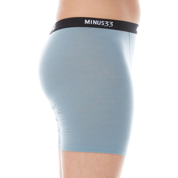 A woman models the microweight merino wool women&