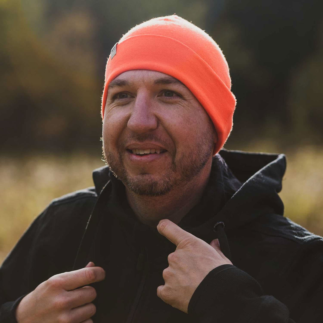 A man models the lightweight, double-layered, hundred percent, super soft merino wool beanie perfect for fall, winter, and spring. This hat is perfect for a hike up the mountain or a walk around the block!
