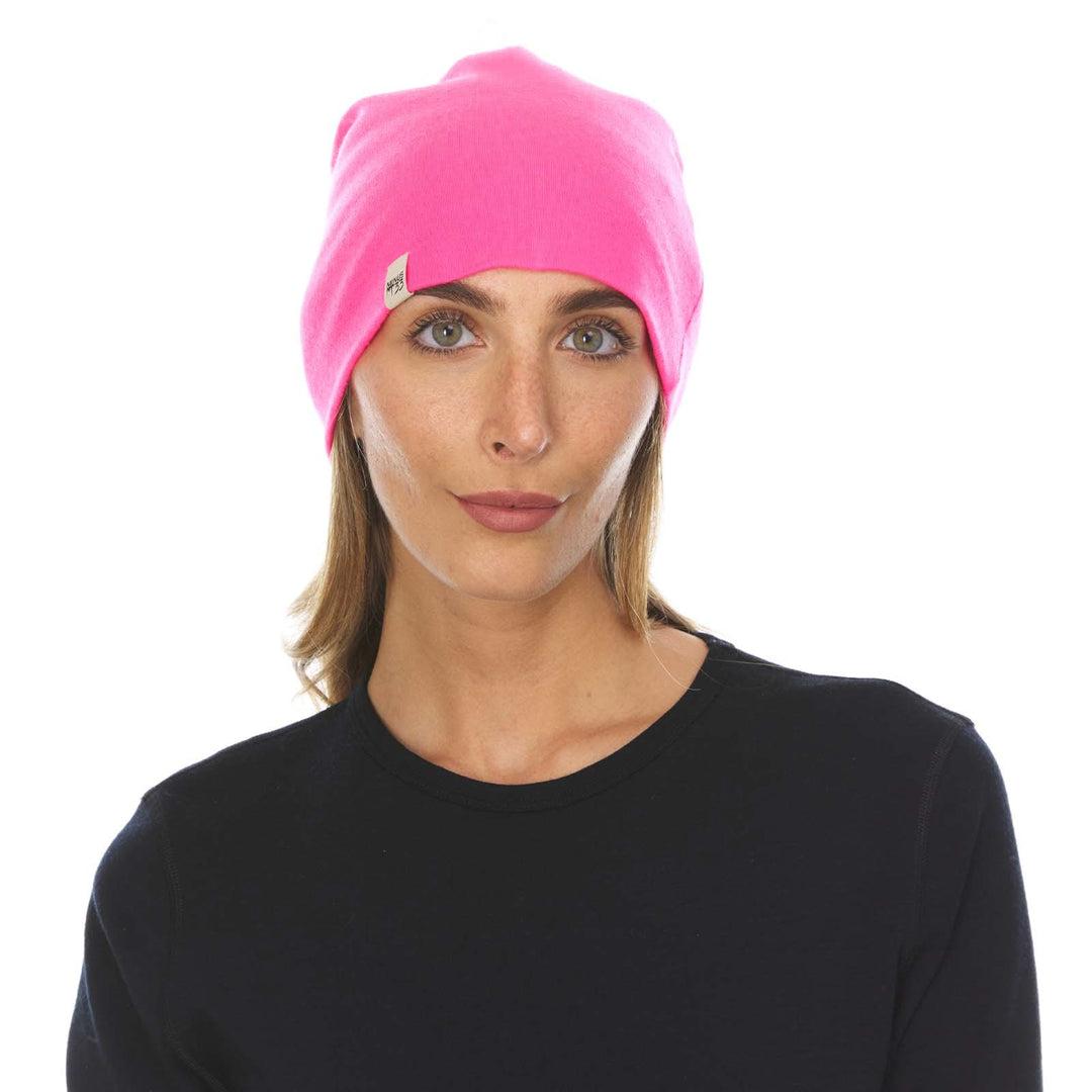 A woman models the lightweight, double-layered, hundred percent, super soft merino wool beanie perfect for fall, winter, and spring. This hat is perfect for a hike up the mountain or a walk around the block!
