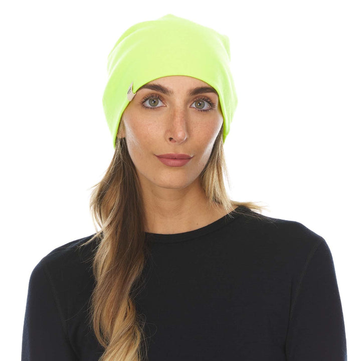 A woman models a lightweight, double-layered, hundred percent, super soft merino wool beanie perfect for fall, winter, and spring. This hat is perfect for a hike up the mountain or a walk around the block!
