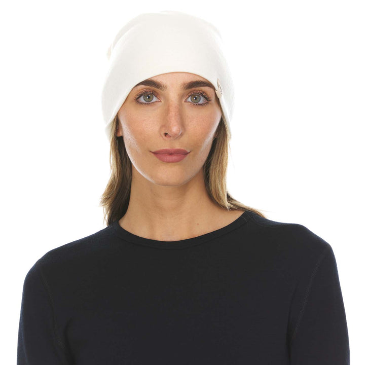 A woman models the lightweight, double-layered, hundred percent, super soft merino wool beanie perfect for fall, winter, and spring. This hat is perfect for a hike up the mountain or a walk around the block!
