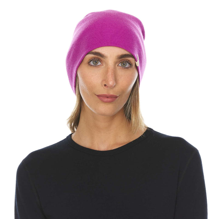 A woman models a lightweight, double-layered, hundred percent, super soft merino wool beanie perfect for fall, winter, and spring. This hat is perfect for a hike up the mountain or a walk around the block!
