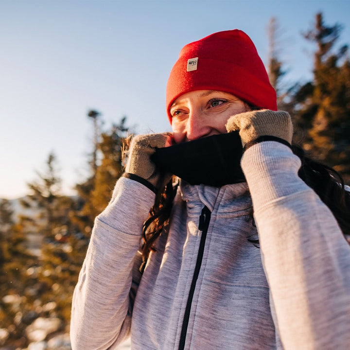 A woman models a lightweight, double-layered, hundred percent, super soft merino wool beanie perfect for fall, winter, and spring. This hat is perfect for a hike up the mountain or a walk around the block!
