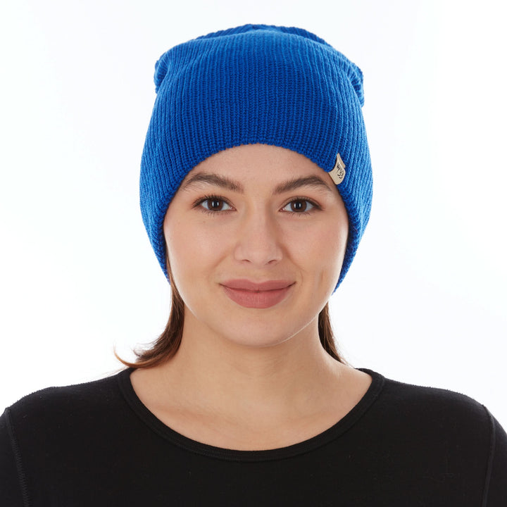 A woman models the midweight hundred percent merino wool beanie, front view 