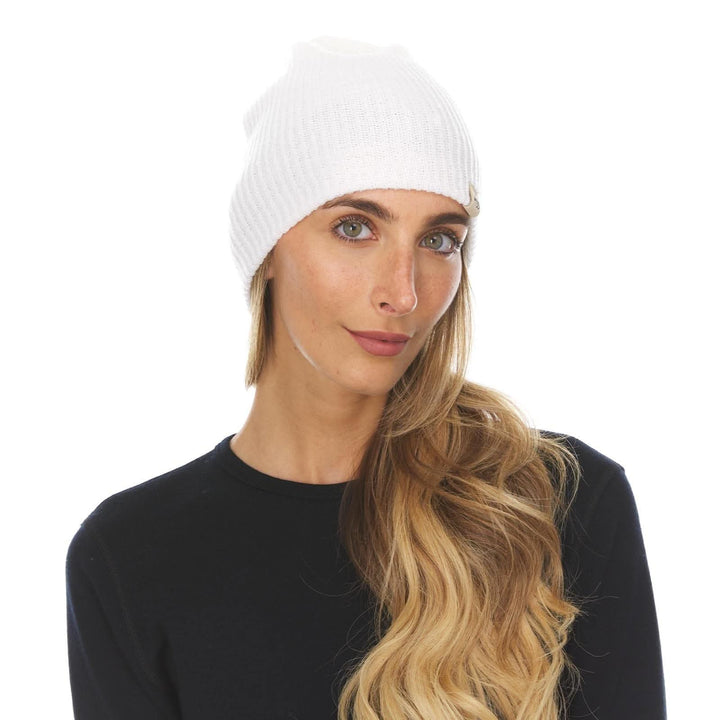 A woman models the midweight hundred percent merino wool beanie 