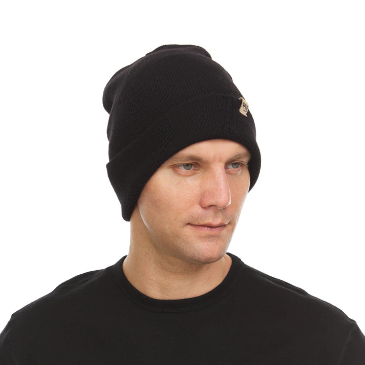 A man models the midweight double-layered merino wool beanie, front view 