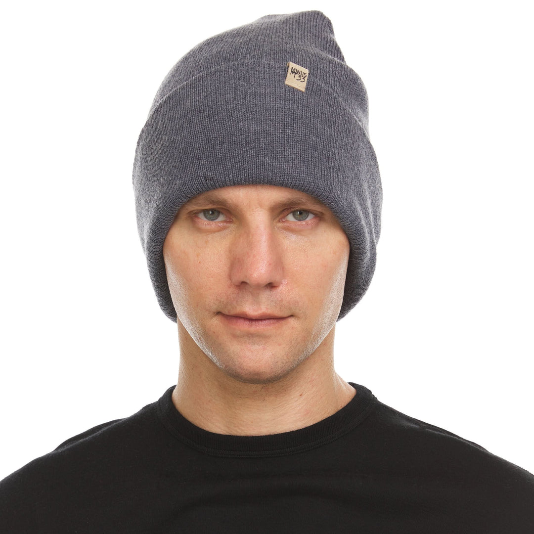 A man models the midweight double-layered merino wool beanie, front view 