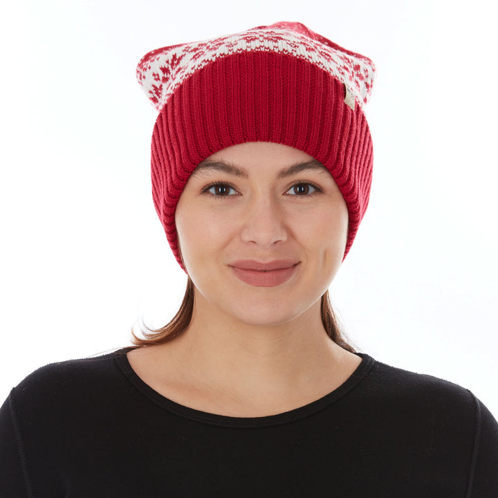 A woman models the midweight, double-layered, hundred percent, super soft merino wool beanie that keeps you warm, but won&