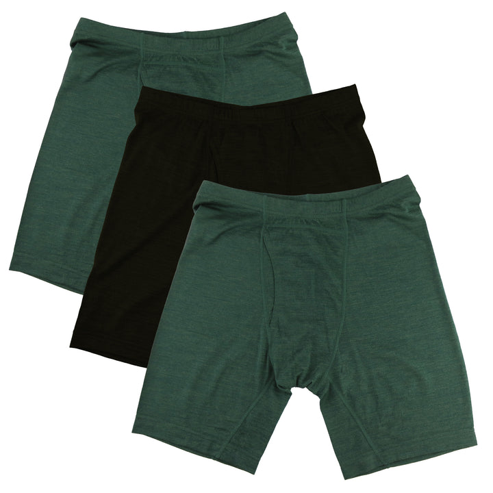 Three pairs of green and black merino wool boxer brief shorts on a white background