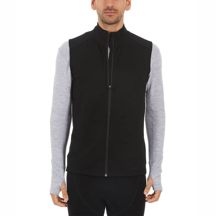 A man models the heavyweight merino wool full-zip vest, front view 