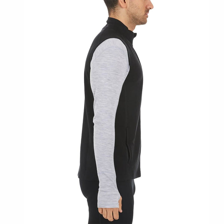 A man models the heavyweight merino wool full-zip vest, right-facing side view rear three-quarter view 