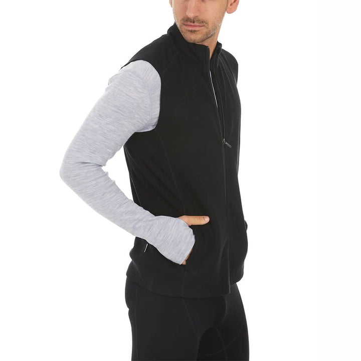 A man models the heavyweight merino wool full-zip vest, right-facing side view 