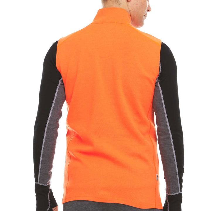 A man models the heavyweight merino wool full-zip vest, back view 