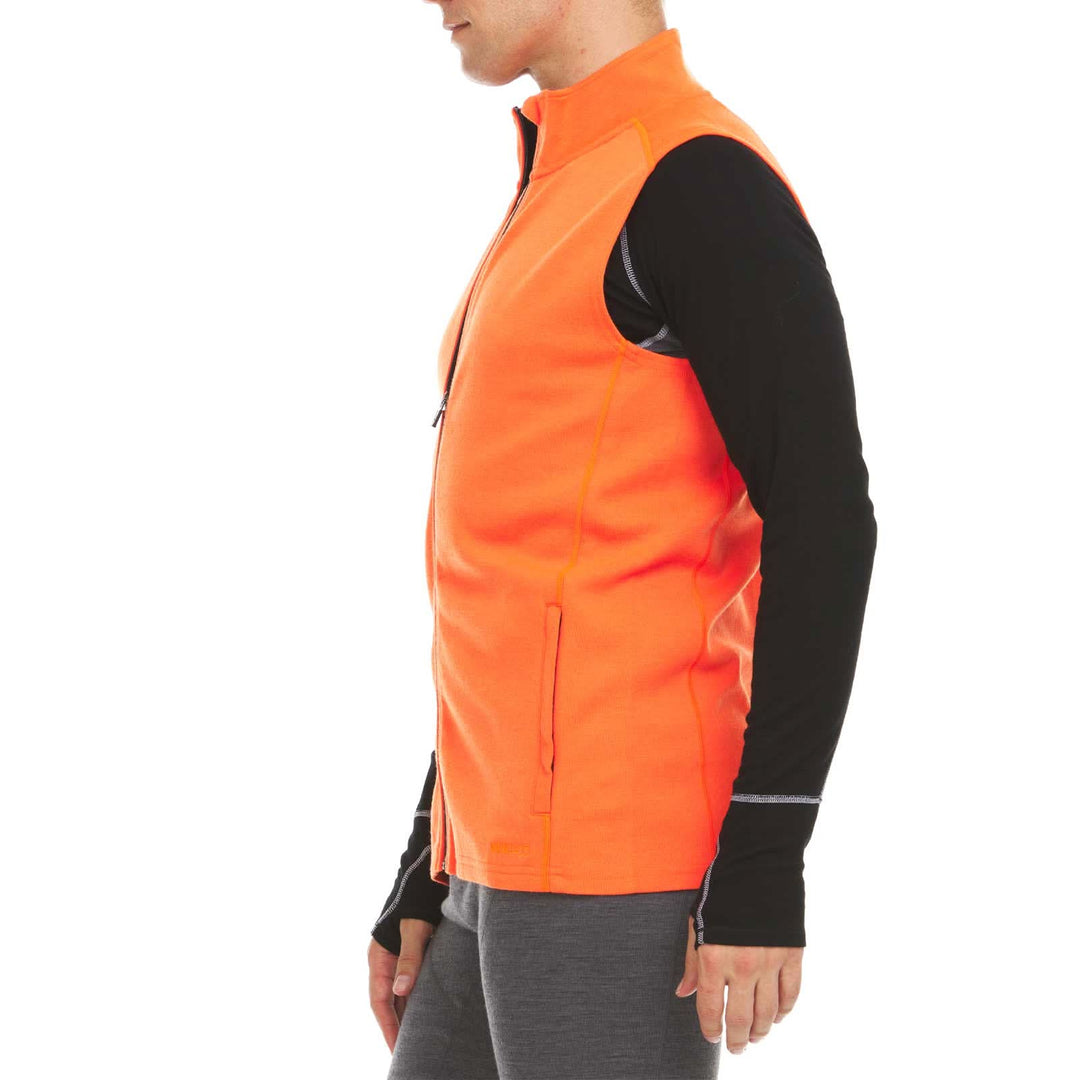 A man models the heavyweight merino wool full-zip vest, right-facing side view 