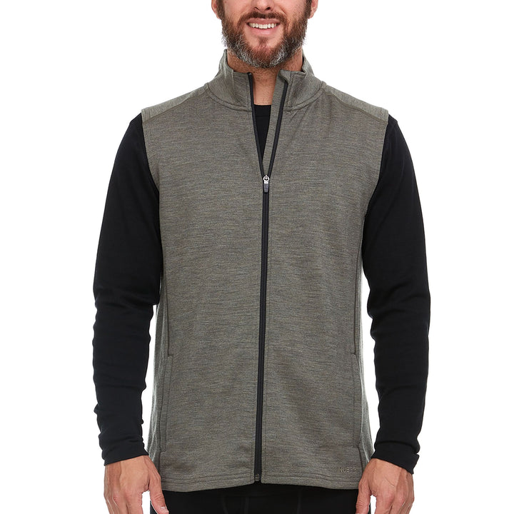 A man models the heavyweight merino wool full-zip vest, front view 