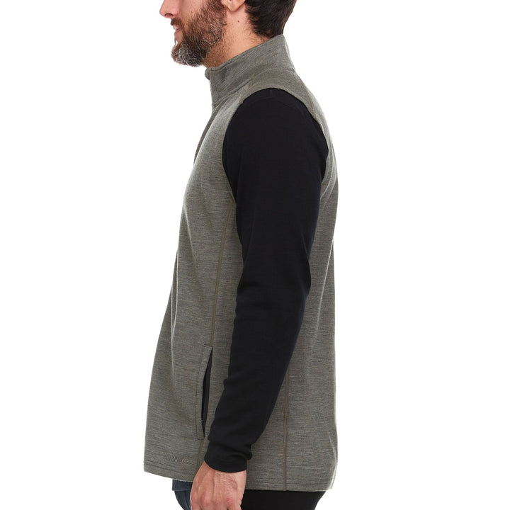 A man models the heavyweight merino wool full-zip vest 