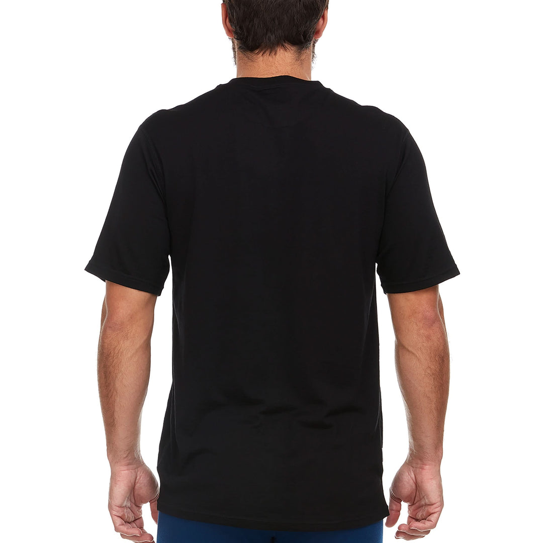 A man models a super soft, short sleeved merino wool t shirt. Use it as a base layer under your work shirt, or wear it all by itself during your next summer summit. 