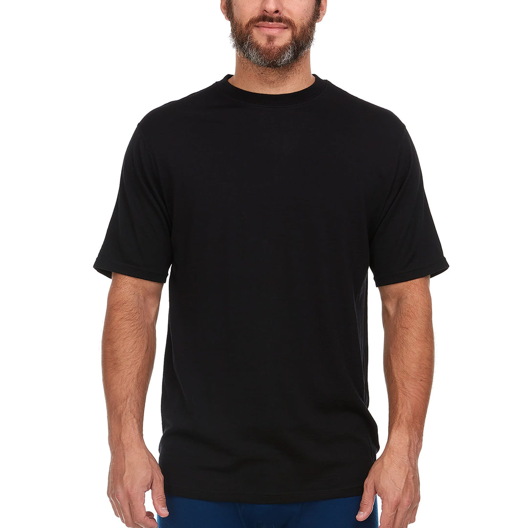 A man models a super soft, short sleeved men's lightweight merino wool t shirt. Use it as a base layer under your work shirt, or wear it all by itself during your next summer summit. #color_black