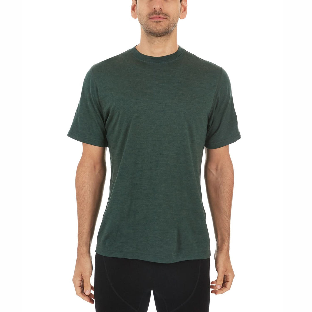 A man models a super soft, short sleeved merino wool t shirt. Use it as a base layer under your work shirt, or wear it all by itself during your next summer summit, front view 