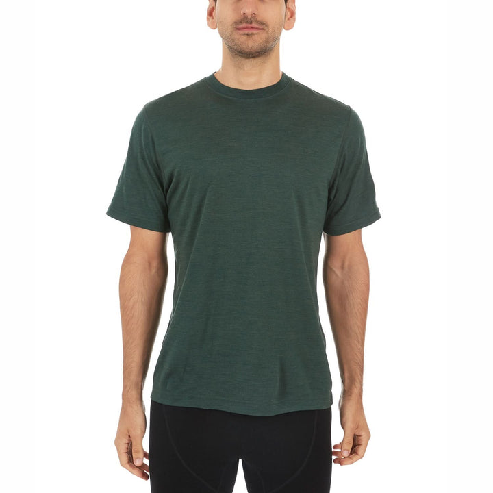 A man models a super soft, short sleeved merino wool t shirt. Use it as a base layer under your work shirt, or wear it all by itself during your next summer summit, front view 
