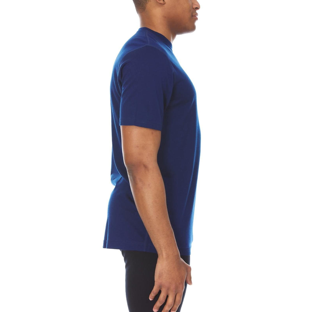 A man models a super soft, short sleeved merino wool t shirt Use it as a base layer under your work shirt, or wear it all by itself during your next summer summit. 