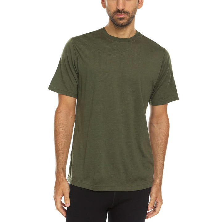 A man models a super soft, short sleeved merino wool t shirt. Use it as a base layer under your work shirt, or wear it all by itself during your next summer summit, front view 