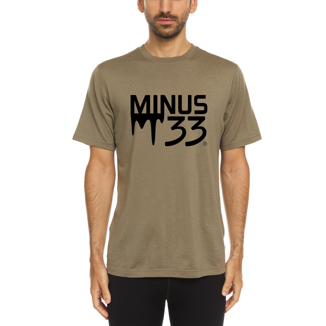 Person wearing a khaki t-shirt with &
